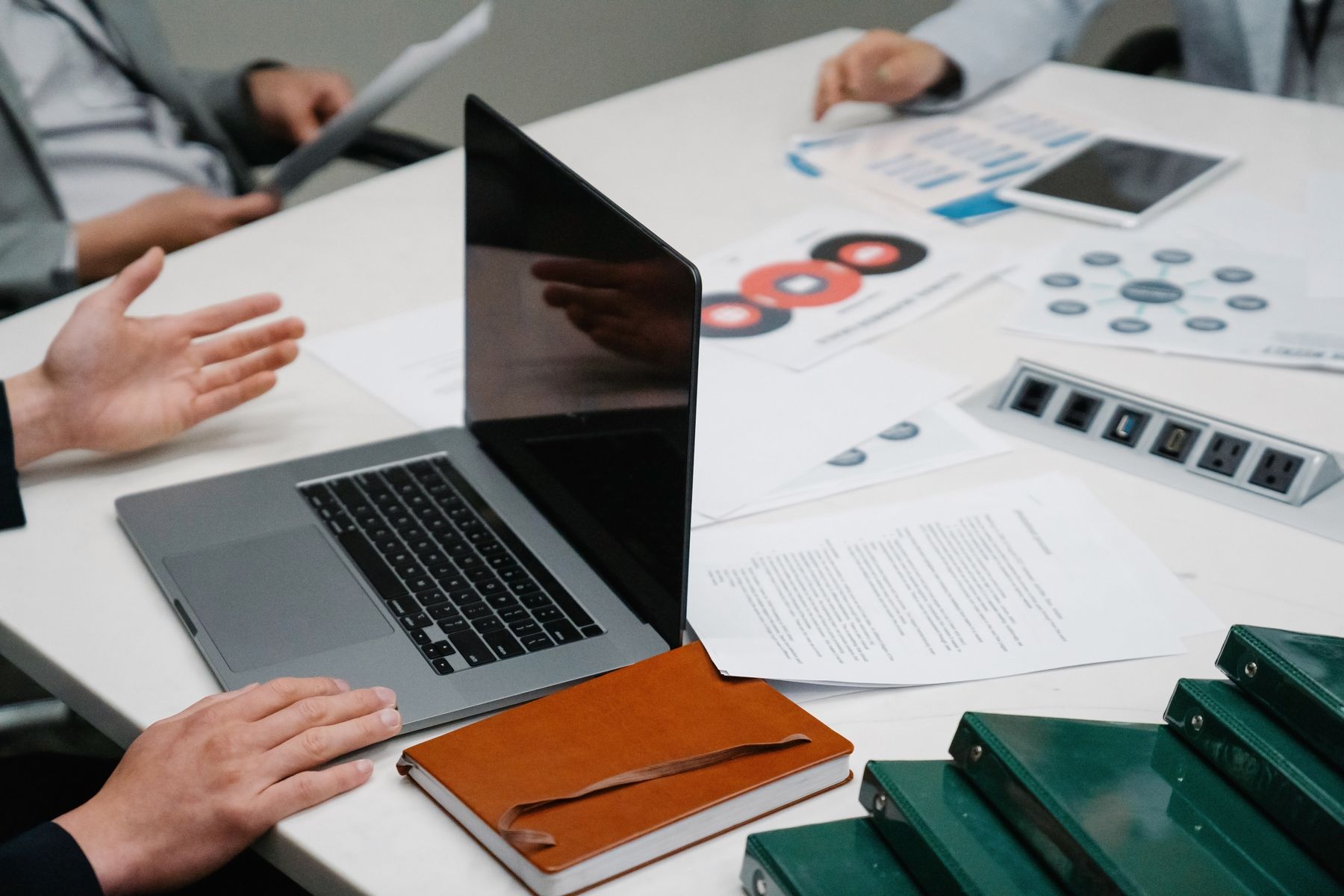 Consulting session with business documents, analysis and collaborative discussion