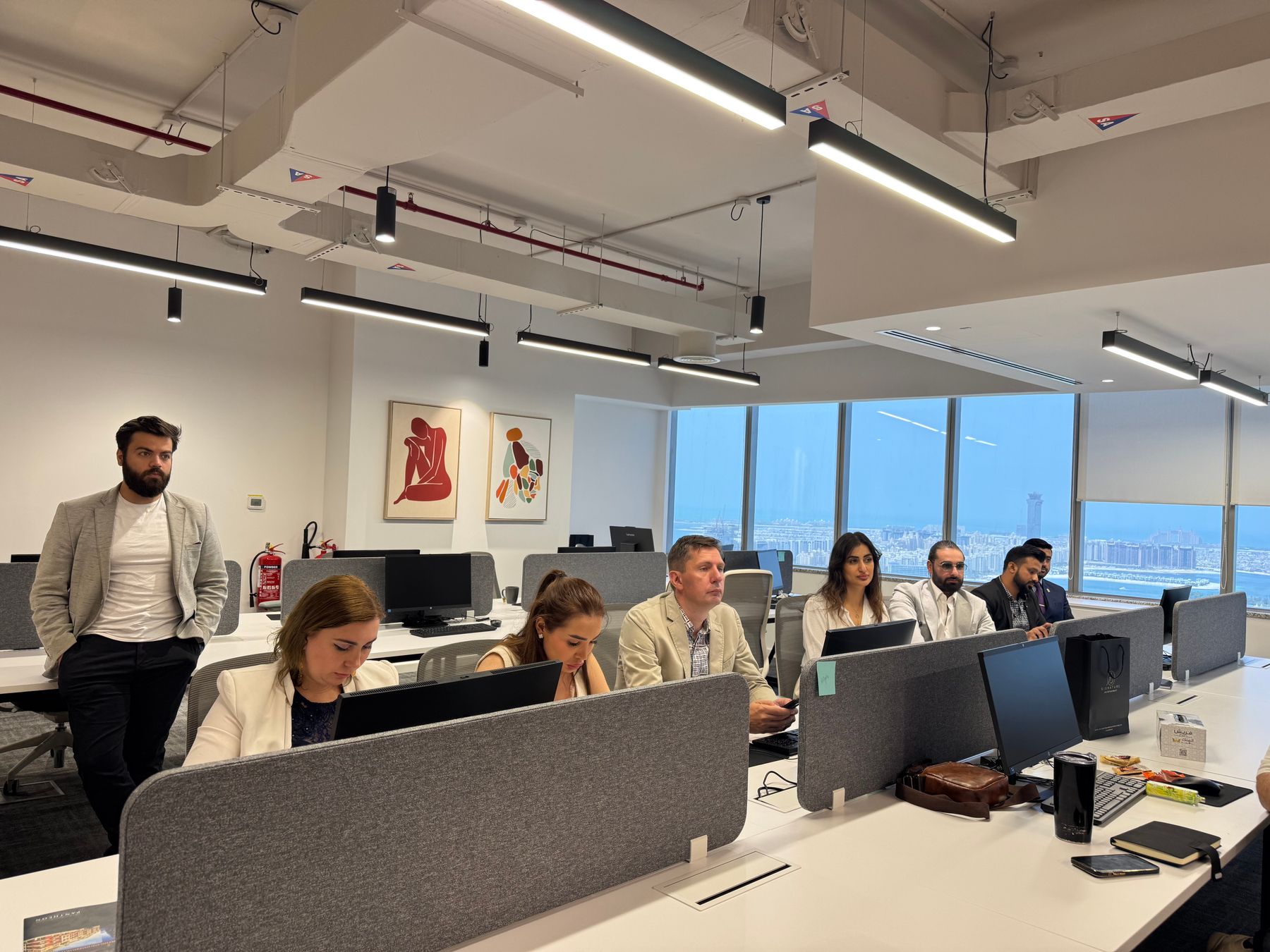 Business team working together in a modern Dubai office